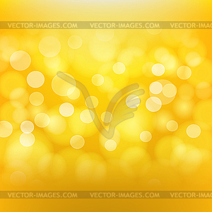 Golden background with blurred light effects - vector clipart
