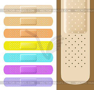 Set of medical plasters with different colors. - stock vector clipart