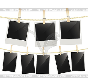 Photo frames hanging on clothesline with clothespin - vector image