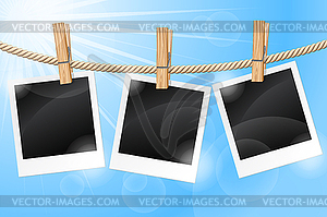 Photos hanging on clothesline - vector image