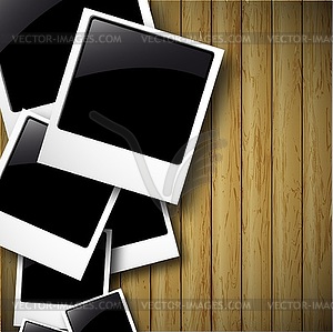 Old polaroid photos on wood background - vector clipart