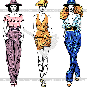 Fashion top models in trouser suits and hats - vector clip art