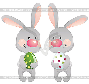 Funny rabbits with eggs - vector clipart