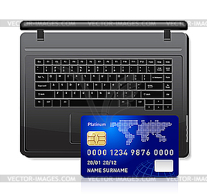 Credit card on laptop - vector image