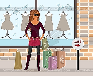 Modern girl loaded with shopping bags - vector clipart