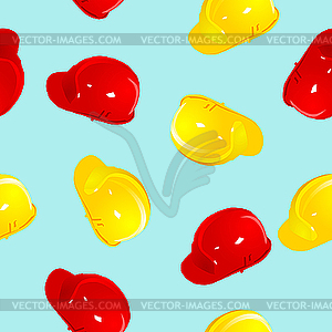 Seamless texture with red and yellow helmets - vector image