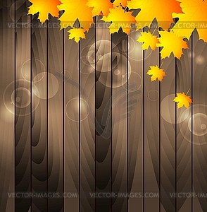 Autumn maple leaves on wooden background - vector clip art