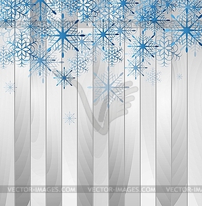 Blue falling snowflakes on wooden background - vector clip art