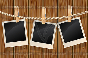 Photos hanging on clothesline - vector clip art