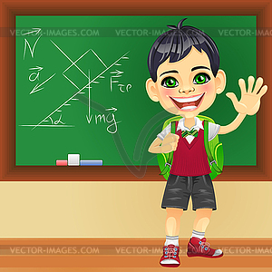 Smiling schoolboy near blackboard - vector clipart