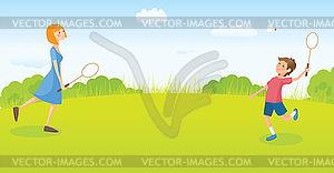 Boy and girl playing badminton - vector clipart