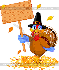 Thanksgiving turkey holding sign - vector clipart