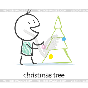 Man Dresses Up Christmas Tree - vector image