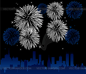 Vector fireworks over a city - vector clip art