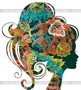 Beautiful woman silhouette with autumn leaves - vector clipart