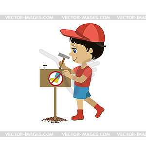 Boy Establishing Garden Sign - vector clip art