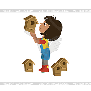 Girl Installing Bird Houses - vector clipart