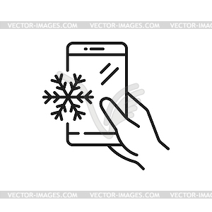Snowflake on smartphone screen in hand, outline - vector image