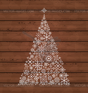 Christmas pine made of snowflakes on wooden - vector image