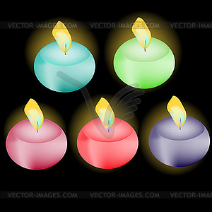 Set of colored candles on black background - stock vector clipart