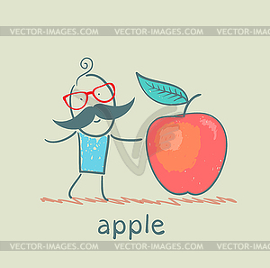 Man stands next to large apple - vector clipart