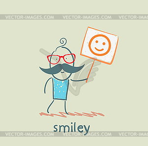 Man holds poster with smiley - vector clipart