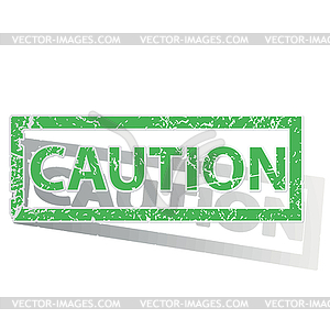 Green outlined CAUTION stamp - vector image