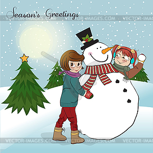 Two happy girls building snowman - vector clip art