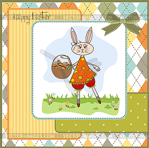 Easter bunny with basket of Easter eggs - vector clip art