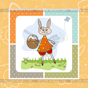 Easter bunny with basket of Easter eggs - color vector clipart