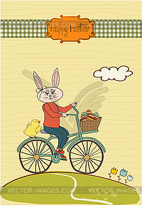 Easter bunny with basket of Easter eggs - vector clipart