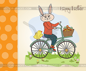 Easter bunny with basket of Easter eggs - vector clipart