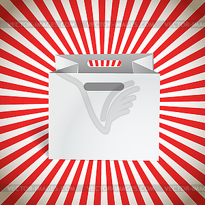 Paper shopping bag with red rays - vector clipart