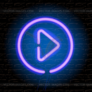 Neon music play button on brick wall - vector clip art