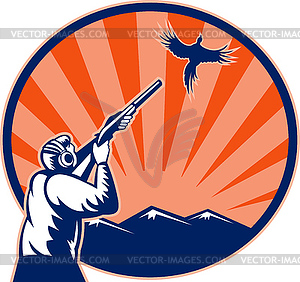 Hunter aiming shotgun rifle at bird pheasant - vector clip art