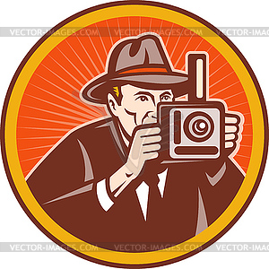 Photographer with hat aiming retro camera - vector clip art