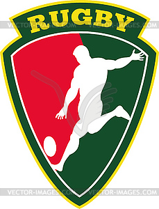 Rugby player kicking ball shield - vector clip art