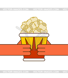 Popcorn and hand. Paper box popped corn - vector image