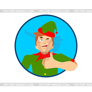 Elf Santa helper thumbs up and winks emoji. New Yea - vector clip art