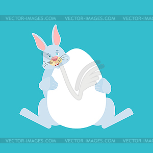 Кролик и яйцо. Пасхальный заяц - векторный рисунок
