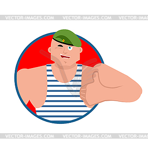 Russian soldier thumbs up and winks. Airborne troop - vector clipart