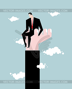 Businessman standing on hand. Rise of man. Help of - vector EPS clipart