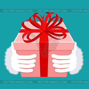 Gift on Christmas. Santa hand and box with bow. - vector clipart