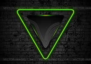 Green neon triangle on dark grunge brick wall - vector clip art