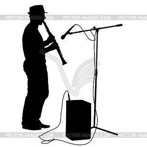 Silhouette musician plays clarinet.  - vector clip art