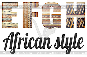 Four letters of alphabet in African style - vector image
