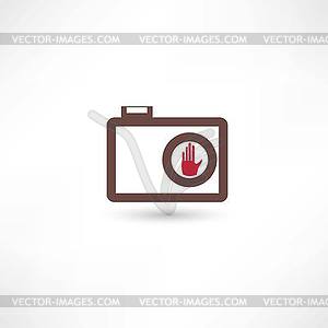 Camera and human hand - vector clip art