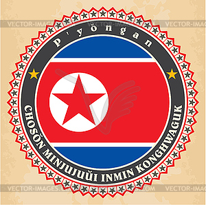 Vintage label cards of North Korea flag - vector clipart