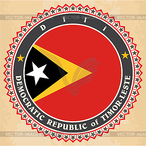 Vintage label cards of East Timor flag - vector image