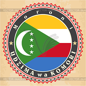 Vintage label cards of Comoros flag - vector EPS clipart